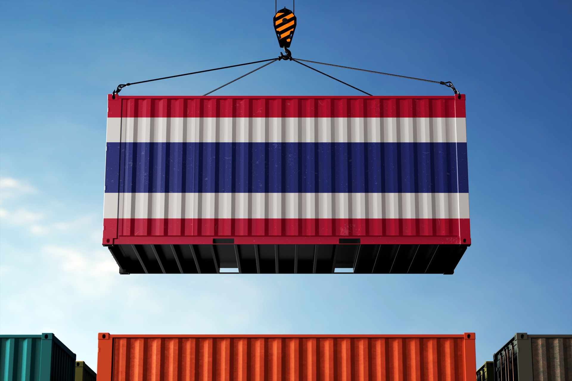 Thailand trade cargo container hanging against clouds background